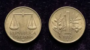 Moneta da 1 lira italiana del 1953 con ape e ramo d'olivo su sfondo scuro