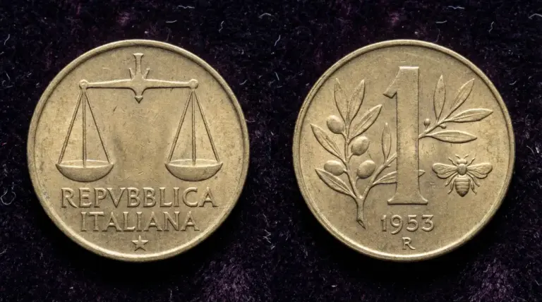 Moneta da 1 lira italiana del 1953 con ape e ramo d'olivo su sfondo scuro